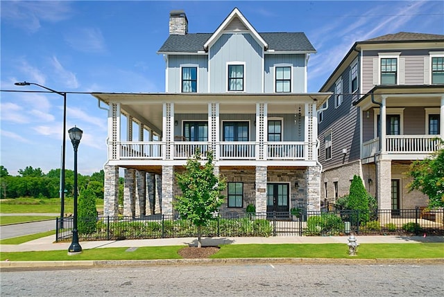 view of front of house featuring a balcony