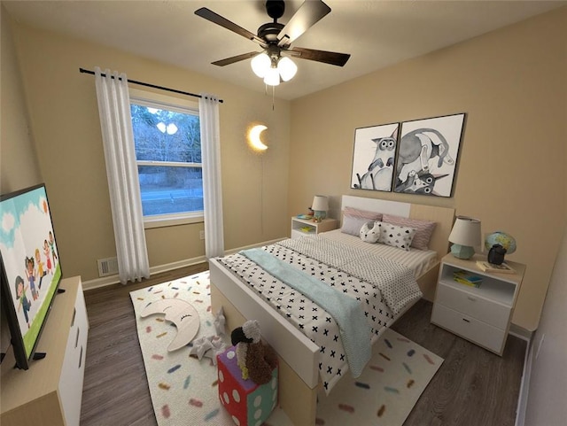 bedroom with ceiling fan and dark wood-type flooring