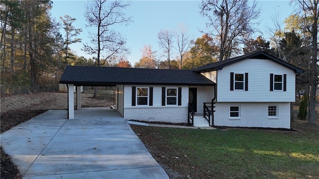 view of front facade with a carport and a front yard