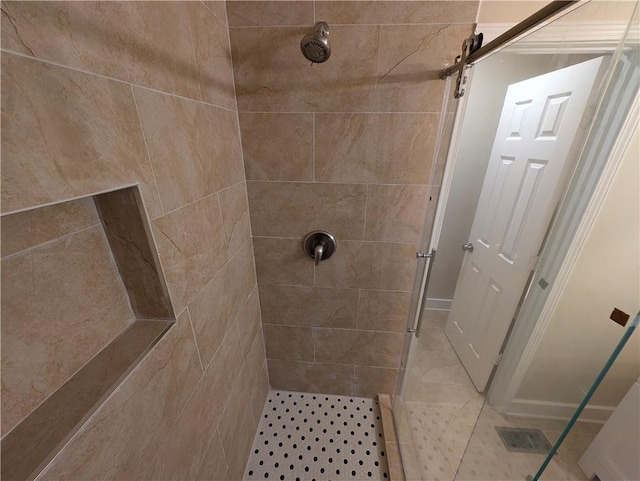 bathroom with tiled shower