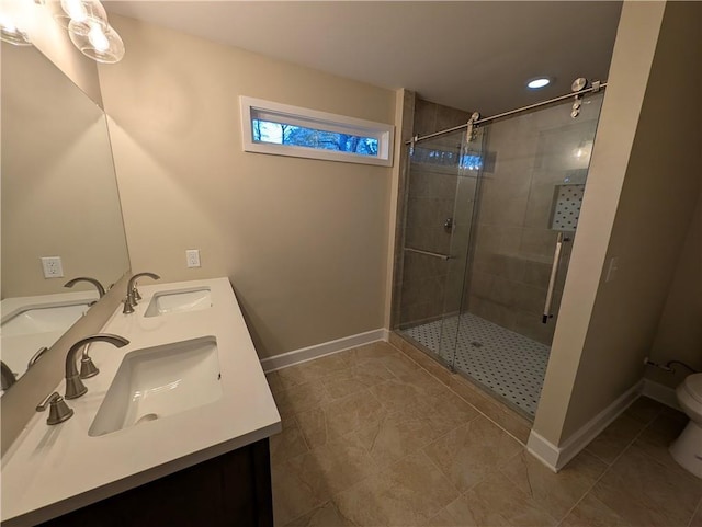 bathroom featuring tile patterned flooring, vanity, an enclosed shower, and toilet