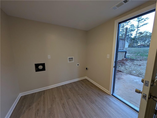 clothes washing area with washer hookup, wood-type flooring, and electric dryer hookup