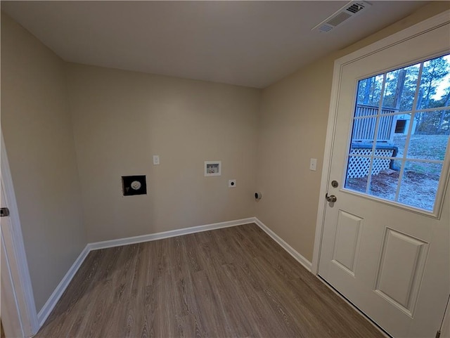 clothes washing area with electric dryer hookup, wood-type flooring, and hookup for a washing machine