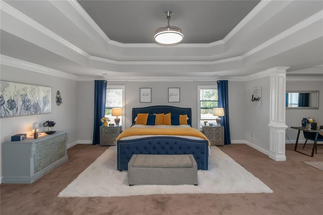 bedroom featuring ornate columns, baseboards, a tray ceiling, and carpet flooring