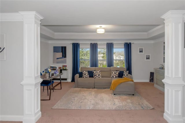 living room with crown molding, carpet flooring, a raised ceiling, and ornate columns