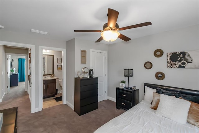 carpeted bedroom with baseboards, visible vents, and ceiling fan