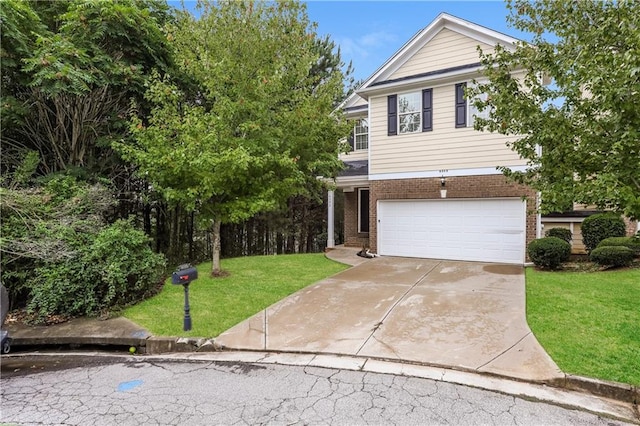 view of front facade featuring a front yard and a garage