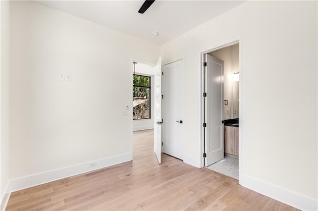 unfurnished bedroom with light wood-type flooring and ceiling fan