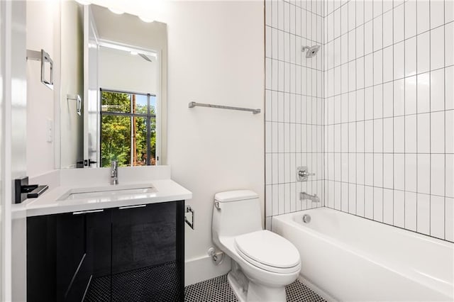 full bathroom with toilet, vanity, tile patterned floors, and tiled shower / bath combo