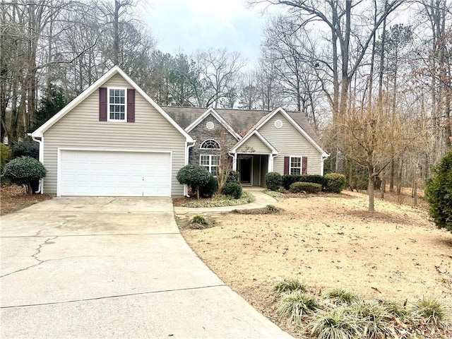 view of front of home with a garage and concrete driveway