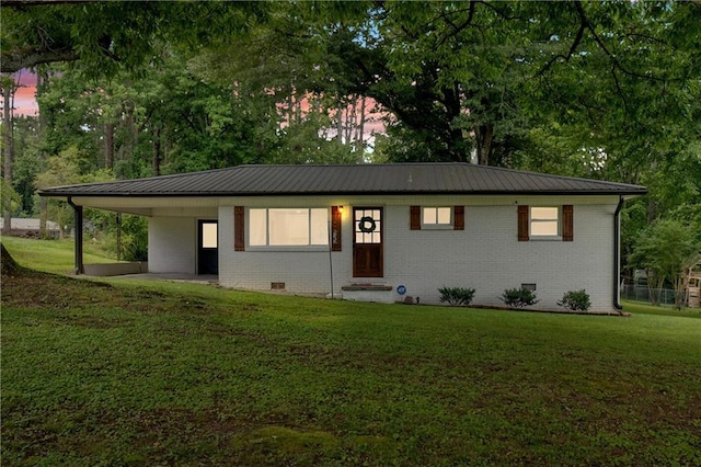 1162 Newtown Church Rd NE, Calhoun, GA 30701 - single story home with a front yard, a metal roof, an attached carport, and brick siding