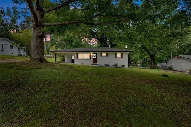 1162 Newtown Church Rd NE, Calhoun, GA 30701 - ranch-style house featuring a front yard, a metal roof, view of wooded area, and an attached carport