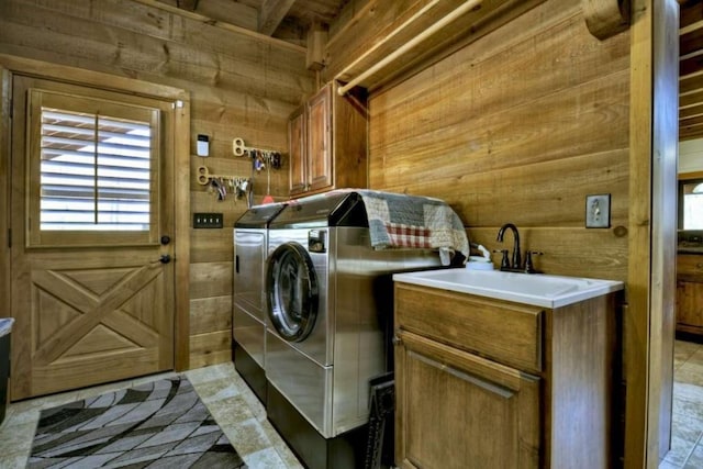 115 Coldwater Creek Dr, Mineral Bluff, GA 30559 - laundry room featuring wooden walls, washing machine and clothes dryer, and cabinet space