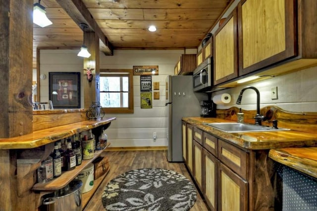 115 Coldwater Creek Dr, Mineral Bluff, GA 30559 - kitchen with wooden ceiling, stainless steel appliances, wood finished floors, brown cabinets, and hanging light fixtures