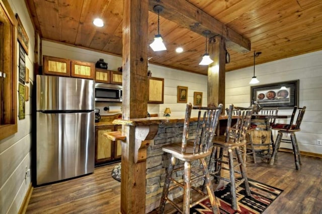 115 Coldwater Creek Dr, Mineral Bluff, GA 30559 - kitchen with stainless steel appliances, wooden ceiling, wood finished floors, brown cabinets, and hanging light fixtures