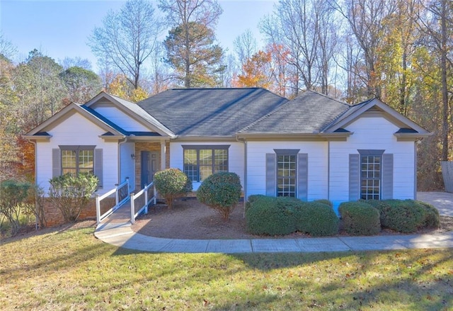 ranch-style home with a front lawn