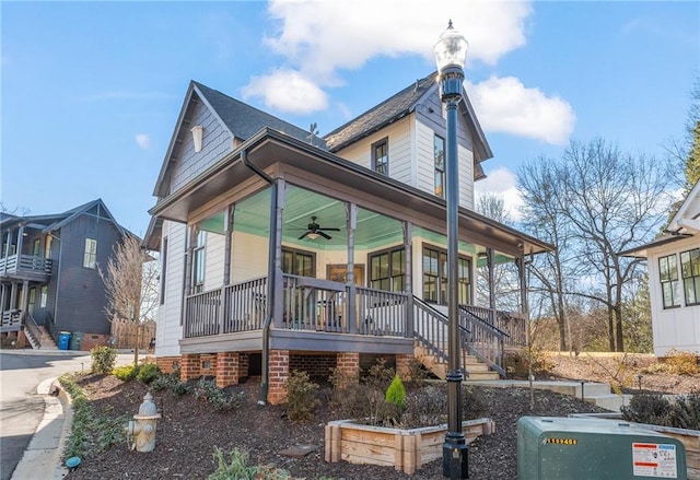 exterior space featuring ceiling fan and a porch