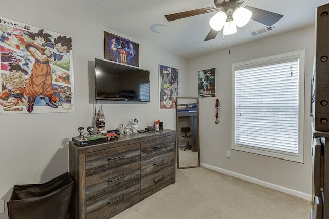 bedroom featuring light carpet, baseboards, visible vents, and ceiling fan