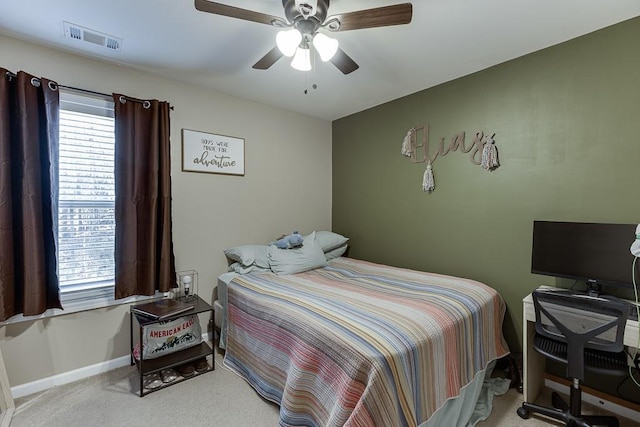 bedroom featuring a ceiling fan, carpet, visible vents, and baseboards