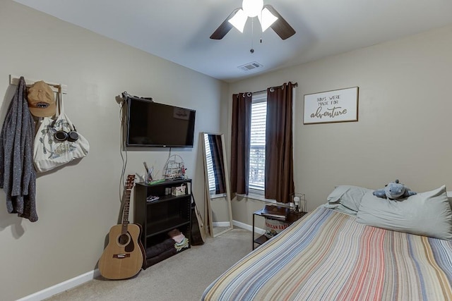 bedroom featuring light carpet, visible vents, and baseboards