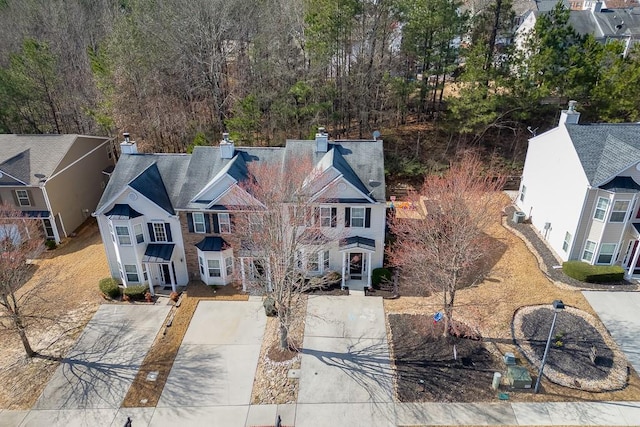 birds eye view of property with a residential view