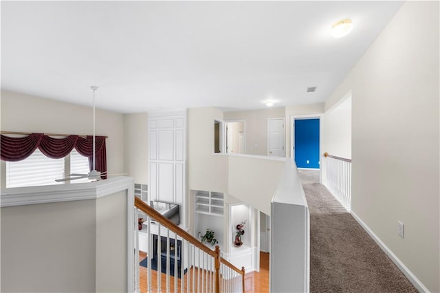 5312 Tormeal Trce, Suwanee, GA 30024 - hall with an upstairs landing, baseboards, and carpet