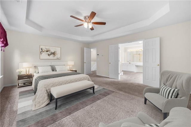 5312 Tormeal Trce, Suwanee, GA 30024 - carpeted bedroom featuring a raised ceiling, baseboards, connected bathroom, and ceiling fan