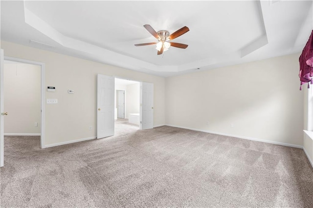 5312 Tormeal Trce, Suwanee, GA 30024 - unfurnished room with a tray ceiling, a ceiling fan, carpet, and baseboards