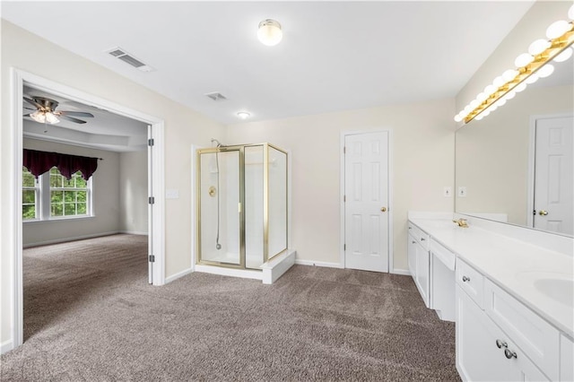 5312 Tormeal Trce, Suwanee, GA 30024 - full bath featuring carpet floors, a shower stall, baseboards, a ceiling fan, and double vanity