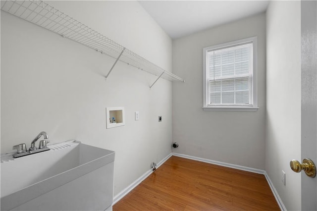 5312 Tormeal Trce, Suwanee, GA 30024 - laundry room with washer hookup, hookup for an electric dryer, baseboards, and wood finished floors