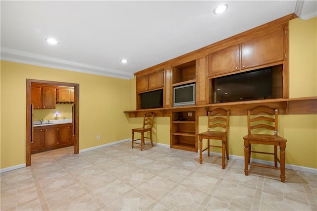 5312 Tormeal Trce, Suwanee, GA 30024 - kitchen featuring open shelves, brown cabinetry, ornamental molding, a breakfast bar, and recessed lighting