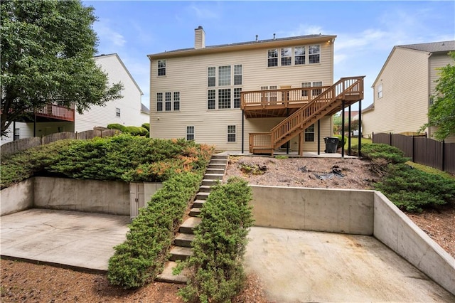 5312 Tormeal Trce, Suwanee, GA 30024 - back of property featuring stairs, a patio area, a wooden deck, and a chimney
