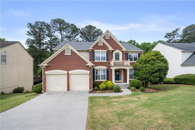 5312 Tormeal Trce, Suwanee, GA 30024 - colonial house featuring brick siding, driveway, a front lawn, and a garage