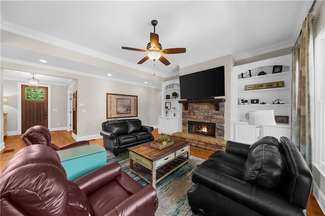 989 Pink Williams Rd, Dahlonega, GA 30533 - living room with baseboards, wood finished floors, a ceiling fan, crown molding, and a fireplace