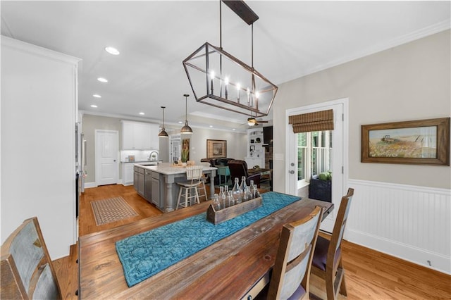 989 Pink Williams Rd, Dahlonega, GA 30533 - dining area with light wood-type flooring, wainscoting, crown molding, recessed lighting, and a chandelier