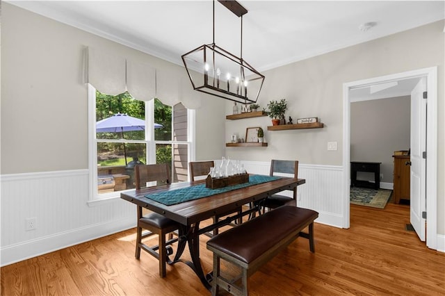 989 Pink Williams Rd, Dahlonega, GA 30533 - dining room featuring wainscoting, wood finished floors, a chandelier, and crown molding