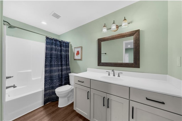 989 Pink Williams Rd, Dahlonega, GA 30533 - bathroom featuring toilet, wood finished floors, vanity, and shower / tub combo