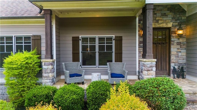 989 Pink Williams Rd, Dahlonega, GA 30533 - property entrance featuring stone siding, a porch, and a shingled roof