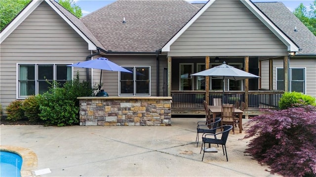 989 Pink Williams Rd, Dahlonega, GA 30533 - rear view of house featuring a patio area, a shingled roof, and stone siding