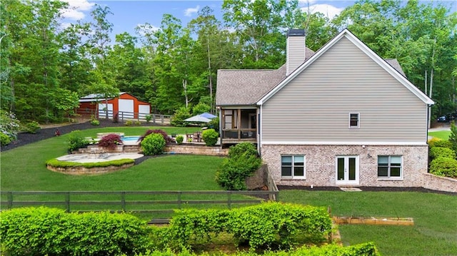989 Pink Williams Rd, Dahlonega, GA 30533 - rear view of property featuring brick siding and a chimney