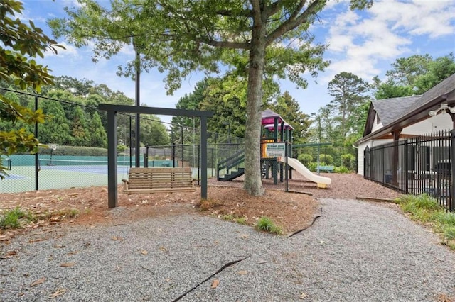 view of playground with tennis court