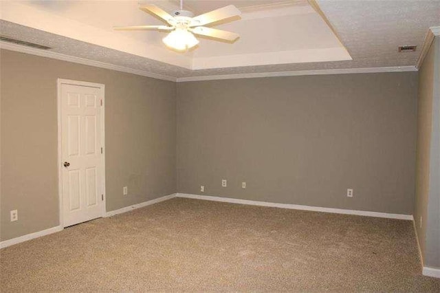 2031 Lakewood Cir, Grayson, GA 30017 - carpeted spare room featuring a tray ceiling, ceiling fan, ornamental molding, and baseboards