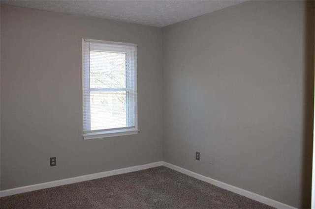 2031 Lakewood Cir, Grayson, GA 30017 - carpeted spare room with baseboards and a textured ceiling