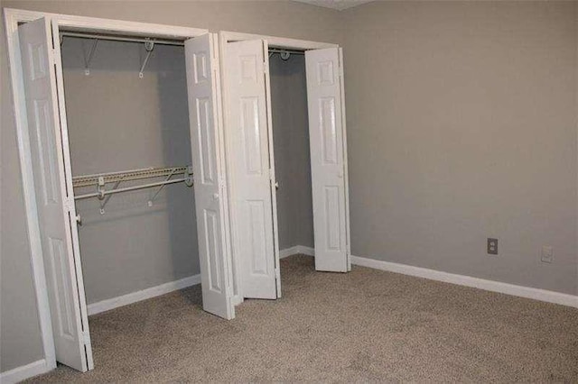 2031 Lakewood Cir, Grayson, GA 30017 - unfurnished bedroom with carpet flooring and baseboards