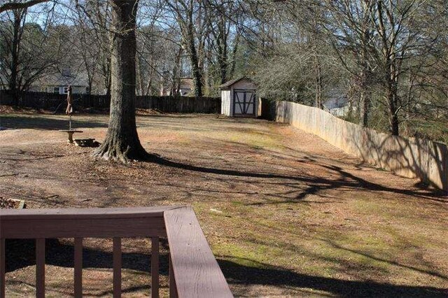 2031 Lakewood Cir, Grayson, GA 30017 - fenced backyard featuring a shed and an outbuilding