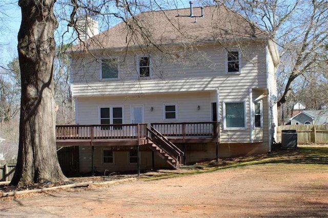2031 Lakewood Cir, Grayson, GA 30017 - back of property with a deck, stairs, and central air condition unit