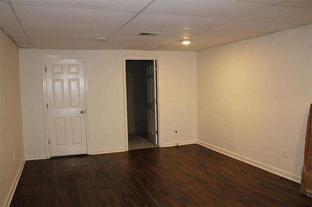 2031 Lakewood Cir, Grayson, GA 30017 - unfurnished bedroom featuring wood finished floors, baseboards, a paneled ceiling, and connected bathroom