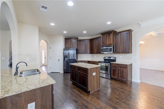 unfurnished living room featuring dark colored carpet and ceiling fan