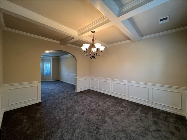 empty room with crown molding, coffered ceiling, beam ceiling, and dark colored carpet