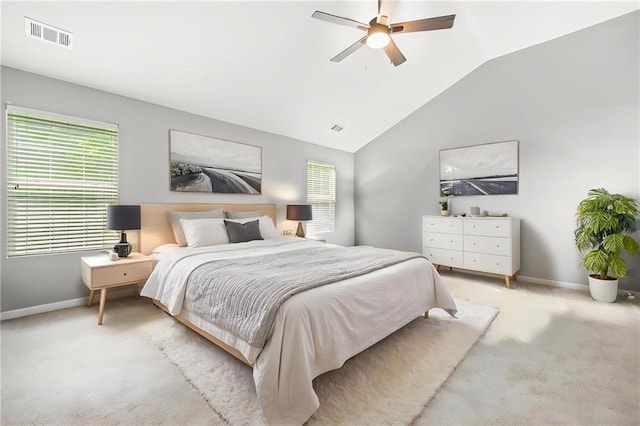 carpeted bedroom with baseboards, multiple windows, visible vents, and vaulted ceiling